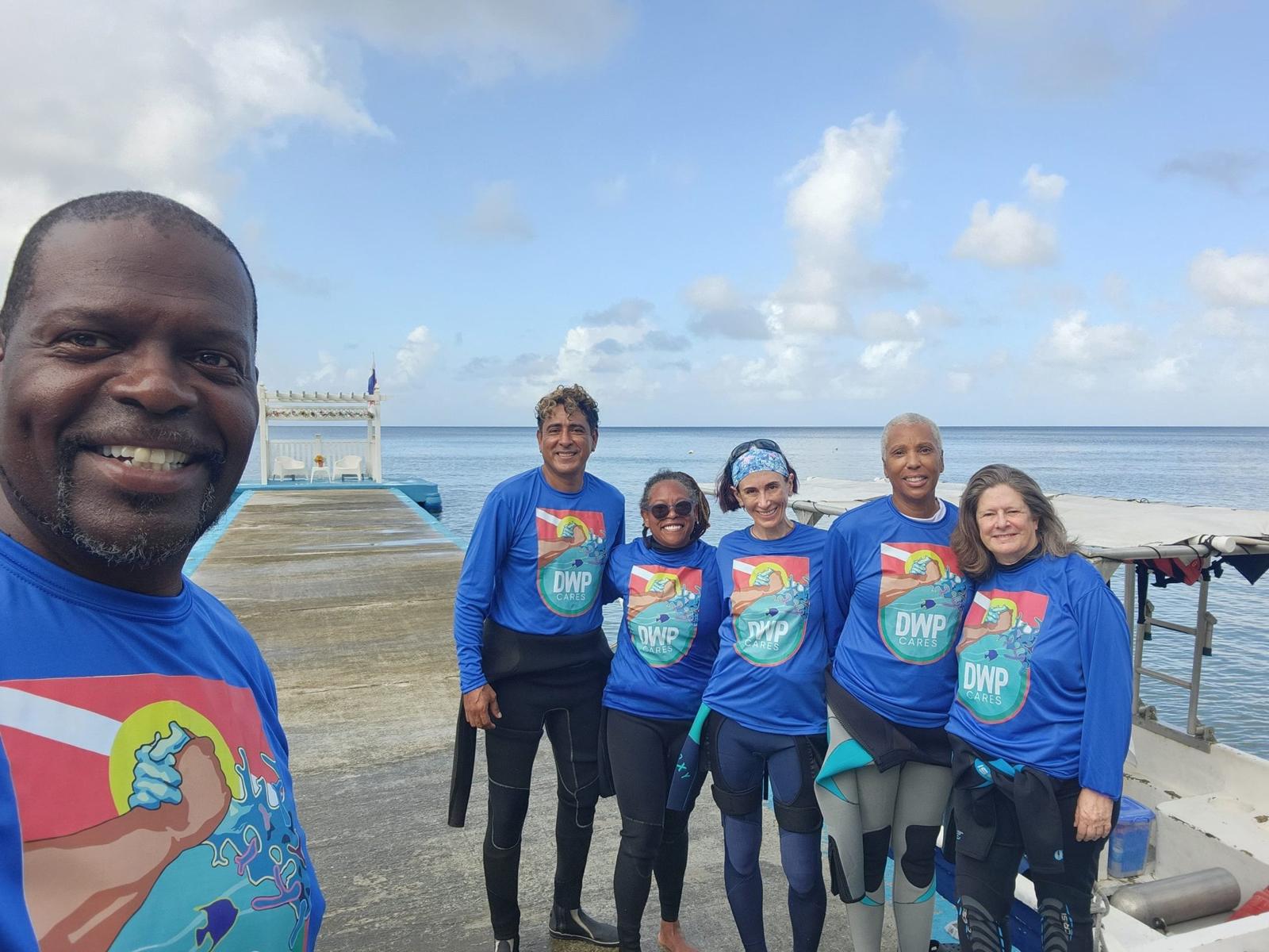DTI CARES conservation team by the ocean